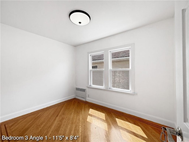 2160 E 36th St, Brooklyn, NY 11234 - unfurnished room featuring radiator and wood finished floors