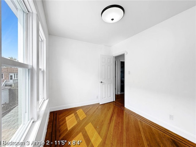 2160 E 36th St, Brooklyn, NY 11234 - spare room featuring baseboards and wood finished floors