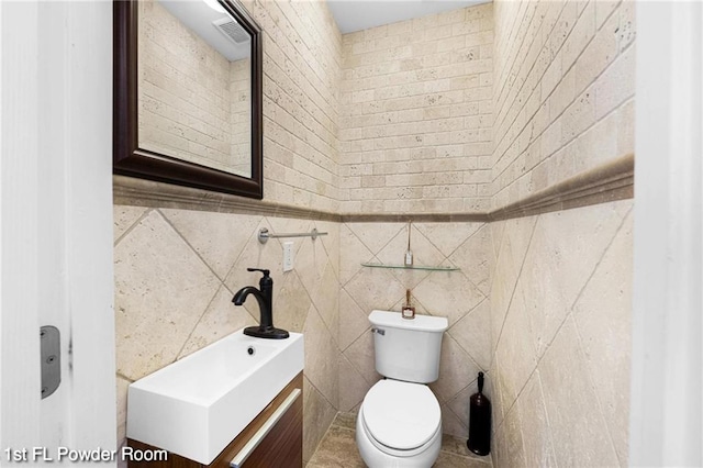 2160 E 36th St, Brooklyn, NY 11234 - half bathroom featuring tile walls and vanity