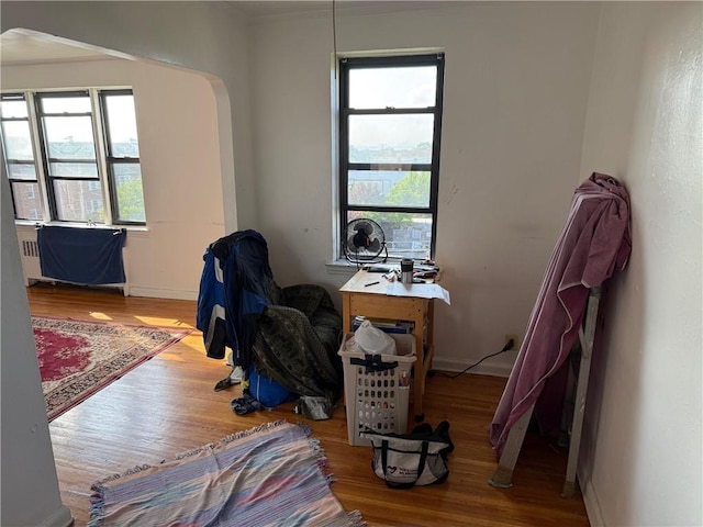 128-11 Newport Ave Unit 4C, Queens, NY 11694 - living area featuring wood finished floors and arched walkways