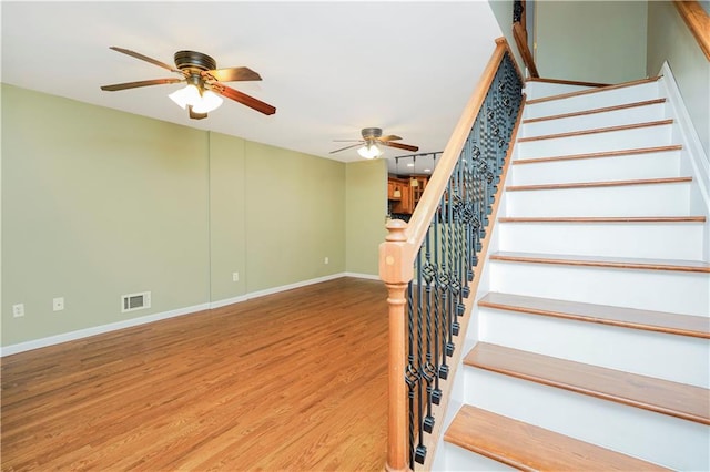 61 Avon Ln, Staten Island, NY 10314 - stairs with wood finished floors and ceiling fan
