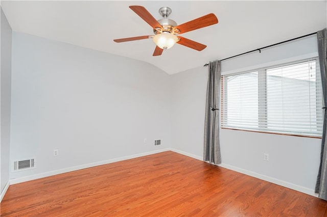 61 Avon Ln, Staten Island, NY 10314 - unfurnished room featuring vaulted ceiling, a ceiling fan, and wood finished floors