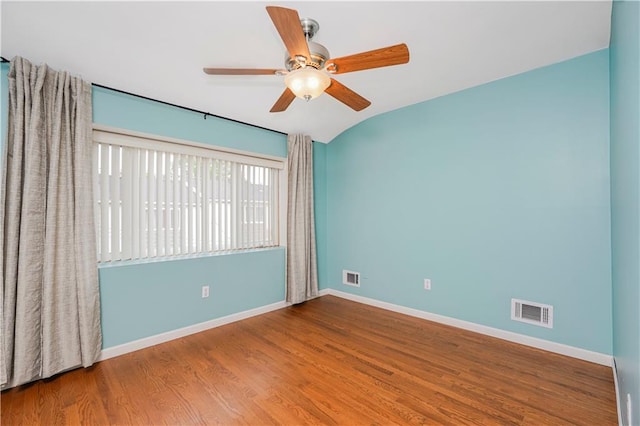 61 Avon Ln, Staten Island, NY 10314 - empty room featuring wood finished floors, ceiling fan, and vaulted ceiling