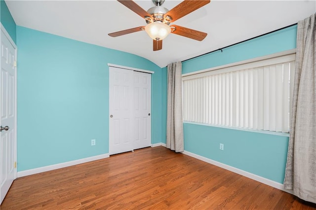 61 Avon Ln, Staten Island, NY 10314 - unfurnished bedroom featuring wood finished floors, ceiling fan, and a closet