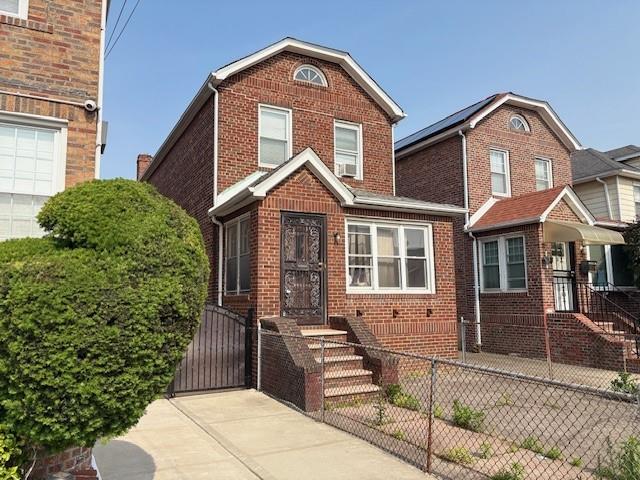 1395 E 46th St, Brooklyn, NY 11234 - view of front of property with brick siding and a gate
