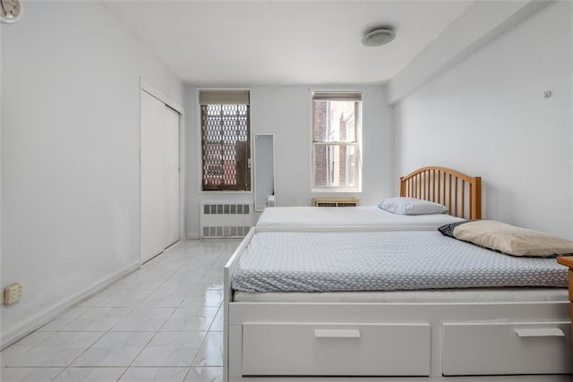 735 Avenue W Unit 6J, Brooklyn, NY 11223 - bedroom featuring radiator heating unit and light marble finish floors