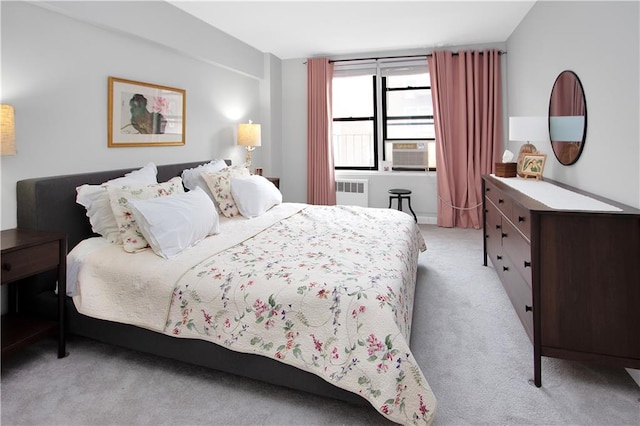 9323 Shore Rd Unit 4G, Brooklyn, NY 11209 - bedroom with radiator heating unit, light carpet, and cooling unit