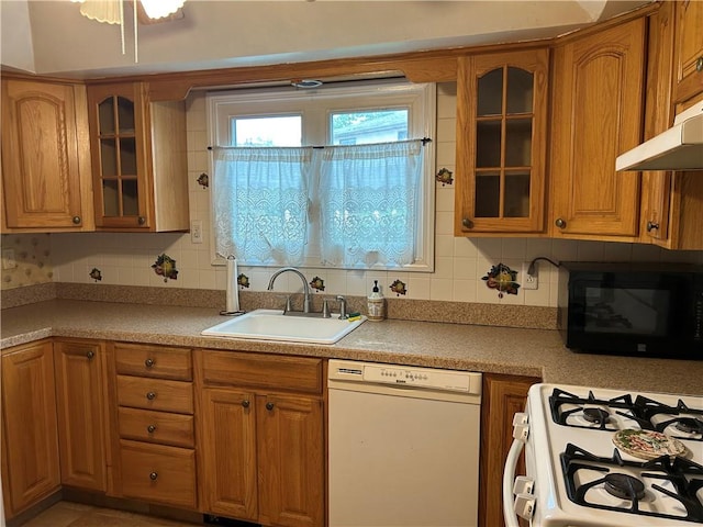 30 Regis Dr Unit 76, Staten Island, NY 10314 - kitchen with white appliances, brown cabinetry, and decorative backsplash