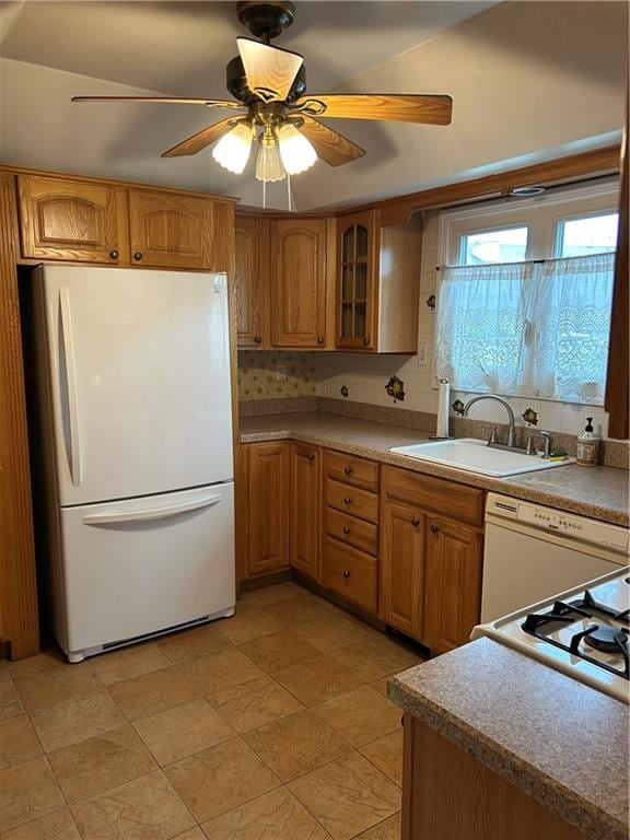 30 Regis Dr Unit 76, Staten Island, NY 10314 - kitchen with white appliances, brown cabinetry, ceiling fan, and glass insert cabinets