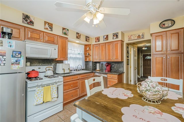 46 Mosely Ave, Staten Island, NY 10312 - kitchen featuring appliances with stainless steel finishes, backsplash, open shelves, dark countertops, and a ceiling fan