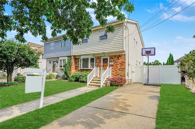 46 Mosely Ave, Staten Island, NY 10312 - view of front of property with brick siding, driveway, and a gate