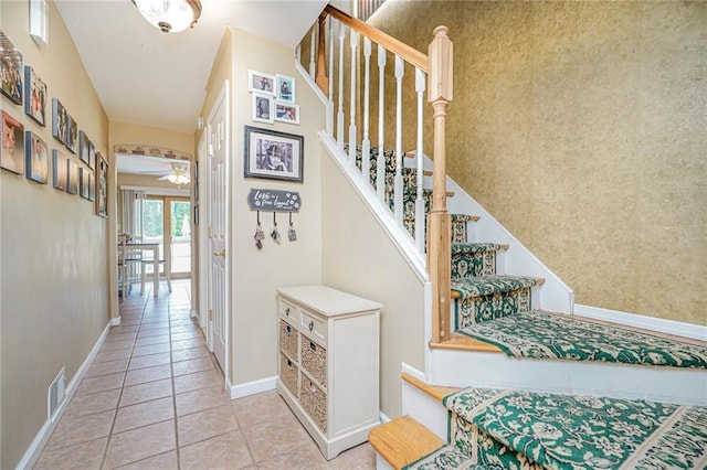 46 Mosely Ave, Staten Island, NY 10312 - stairway with tile patterned floors and a ceiling fan