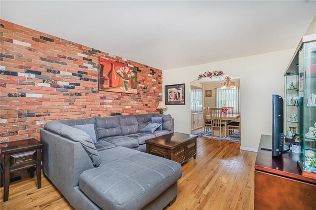 46 Mosely Ave, Staten Island, NY 10312 - living area featuring light wood-type flooring and brick wall