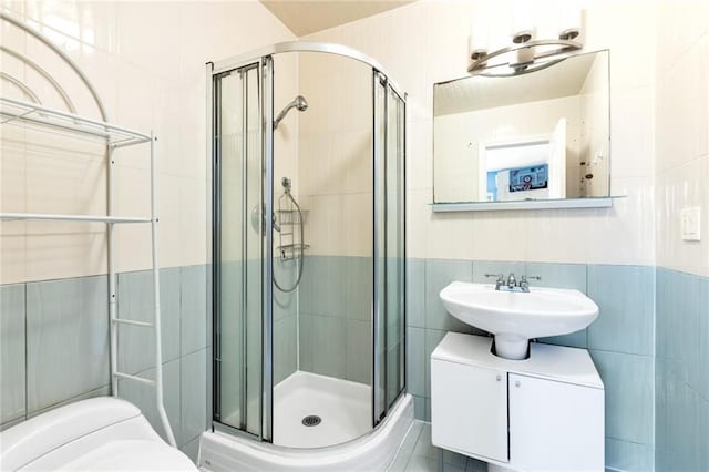 135 28th Ave Unit 2A, Brooklyn, NY 11214 - bathroom with tile walls and a stall shower
