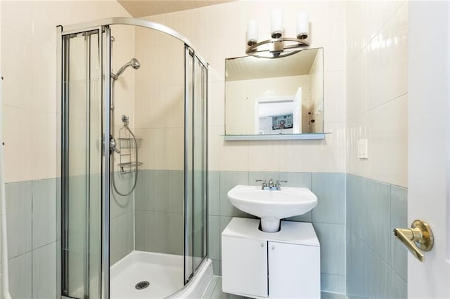 135 28th Ave Unit 2A, Brooklyn, NY 11214 - full bathroom with tile walls and a shower stall