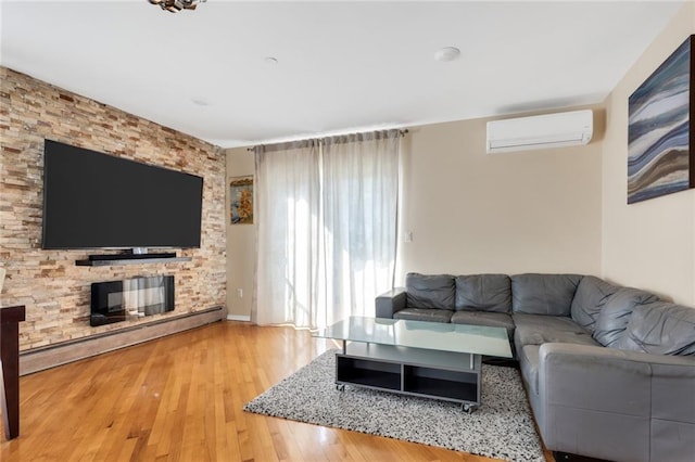 135 28th Ave Unit 2A, Brooklyn, NY 11214 - living area featuring an AC wall unit, a baseboard heating unit, and wood finished floors