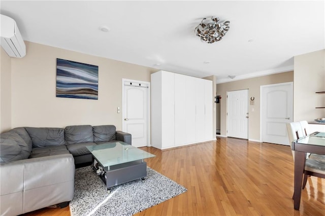 135 28th Ave Unit 2A, Brooklyn, NY 11214 - living room with an AC wall unit and light wood-style flooring