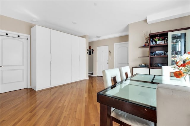 135 28th Ave Unit 2A, Brooklyn, NY 11214 - dining area featuring light wood finished floors
