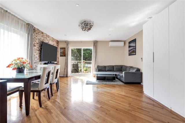 135 28th Ave Unit 2A, Brooklyn, NY 11214 - dining room featuring a wall unit AC and light wood-style floors