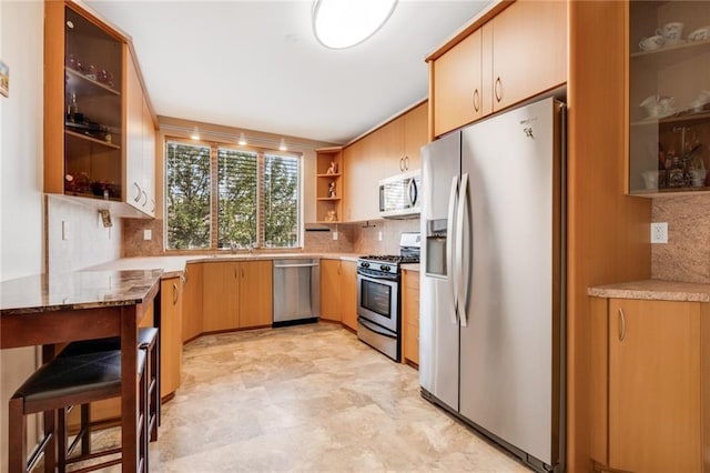 135 28th Ave Unit 2A, Brooklyn, NY 11214 - kitchen with appliances with stainless steel finishes, open shelves, decorative backsplash, and glass insert cabinets