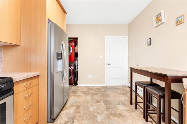 135 28th Ave Unit 2A, Brooklyn, NY 11214 - kitchen featuring appliances with stainless steel finishes and light brown cabinets
