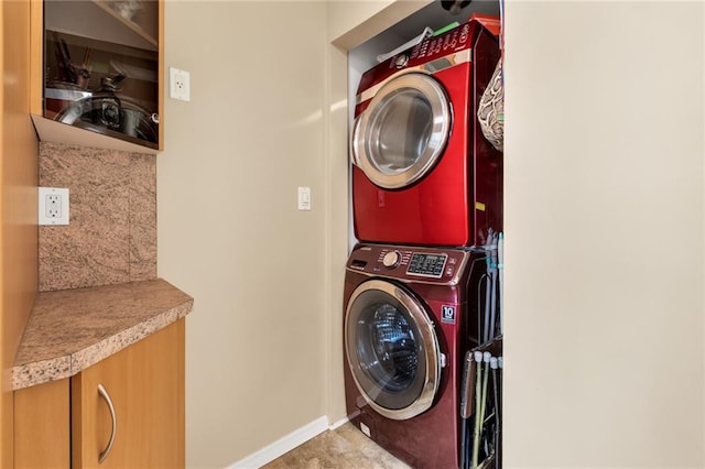 135 28th Ave Unit 2A, Brooklyn, NY 11214 - washroom featuring estacked washer and dryer and baseboards