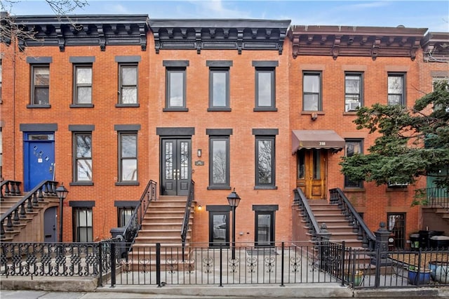 320 10th St, Brooklyn, NY 11215 - townhome / multi-family property featuring brick siding and stairs