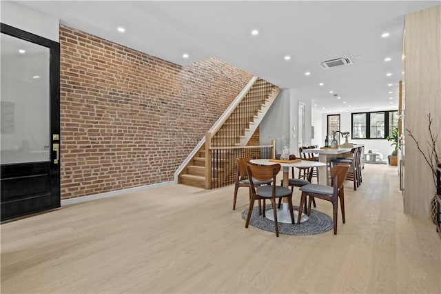 320 10th St, Brooklyn, NY 11215 - dining room with stairway, wood finished floors, brick wall, and recessed lighting