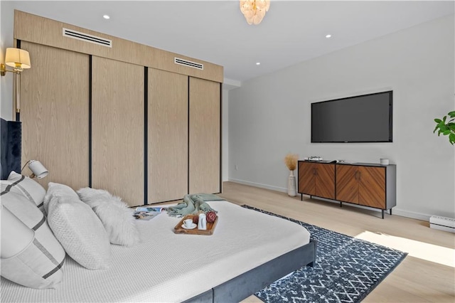 320 10th St, Brooklyn, NY 11215 - bedroom featuring recessed lighting, light wood-style flooring, and a closet