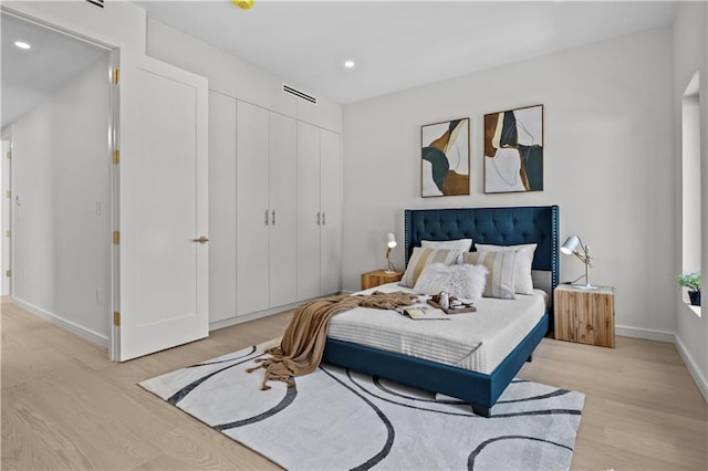 320 10th St, Brooklyn, NY 11215 - bedroom with light wood-style floors, recessed lighting, and a closet