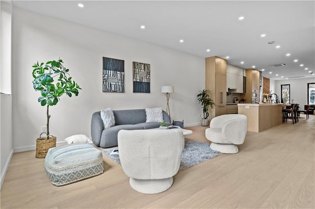 320 10th St, Brooklyn, NY 11215 - living room featuring light wood-style floors and recessed lighting