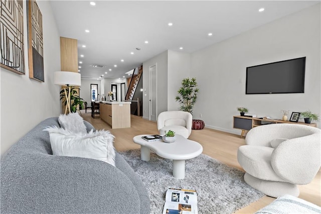 320 10th St, Brooklyn, NY 11215 - living area featuring light wood-style floors, recessed lighting, and stairs