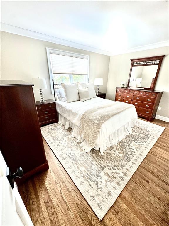 274 S Railroad St, Staten Island, NY 10312 - bedroom featuring wood finished floors and crown molding