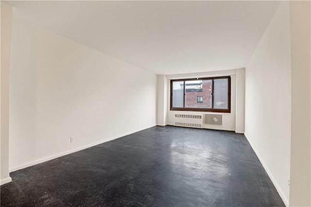 185 Hall St Unit 614, Brooklyn, NY 11205 - unfurnished room with radiator heating unit and concrete floors