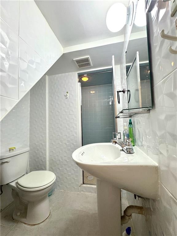 3516 Fillmore Ave, Brooklyn, NY 11234 - full bathroom with tile walls, tile patterned flooring, and a walk in shower