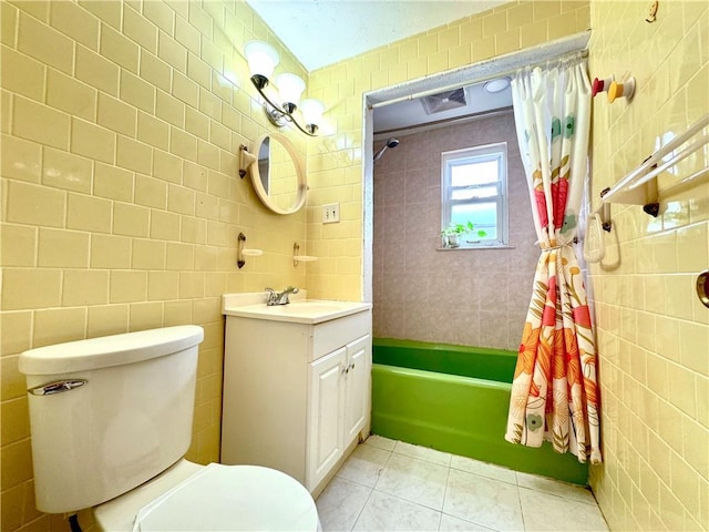 3516 Fillmore Ave, Brooklyn, NY 11234 - bathroom featuring tile walls, vanity, and shower / bath combo
