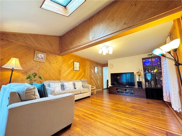 3516 Fillmore Ave, Brooklyn, NY 11234 - living room with a skylight, light wood finished floors, and wood walls