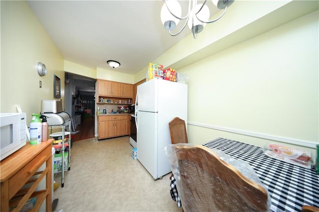 1296 E 54th St, Brooklyn, NY 11234 - kitchen with white appliances, a chandelier, light carpet, and light countertops
