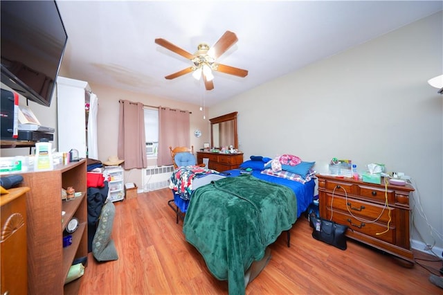 1296 E 54th St, Brooklyn, NY 11234 - bedroom featuring wood finished floors, radiator, and ceiling fan