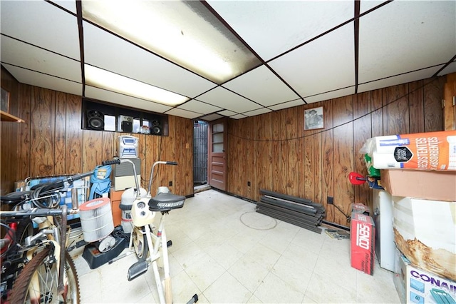 1296 E 54th St, Brooklyn, NY 11234 - finished below grade area with wooden walls, tile patterned floors, and a drop ceiling