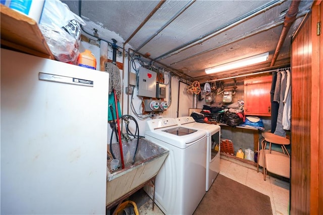 1296 E 54th St, Brooklyn, NY 11234 - laundry area featuring electric panel, separate washer and dryer, and tile patterned floors