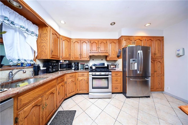 1296 E 54th St, Brooklyn, NY 11234 - kitchen featuring stainless steel appliances, brown cabinets, light tile patterned flooring, recessed lighting, and range hood