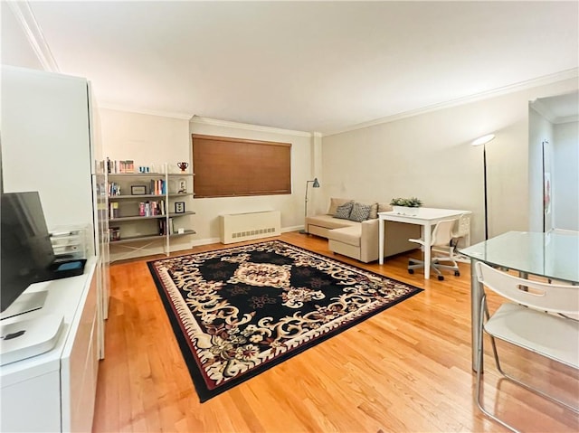 9935 Shore Rd Unit 1D, Brooklyn, NY 11209 - living area featuring crown molding, light wood-style floors, and radiator heating unit