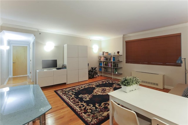 9935 Shore Rd Unit 1D, Brooklyn, NY 11209 - living room with ornamental molding, light wood finished floors, and a desk