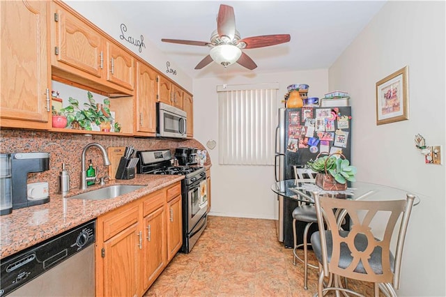 977 80th St, Brooklyn, NY 11228 - kitchen with stainless steel appliances, a ceiling fan, decorative backsplash, and light stone counters