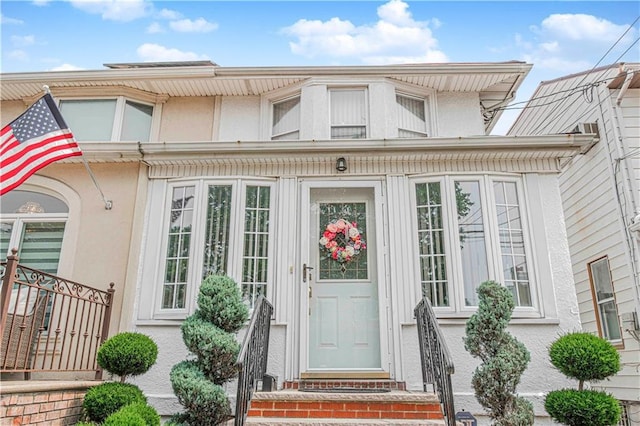977 80th St, Brooklyn, NY 11228 - property entrance featuring stucco siding