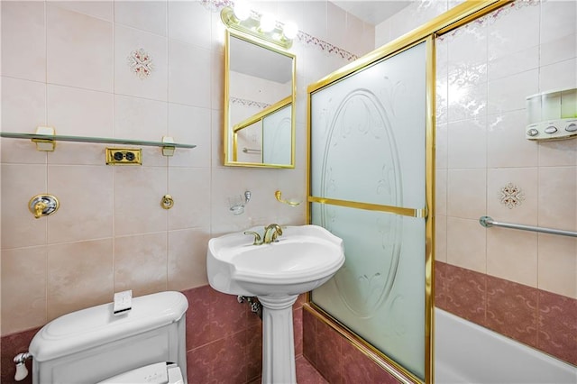 2942 W 5th St Apt 5-N, Brooklyn, NY 11224 - bathroom featuring tile walls and bath / shower combo with glass door