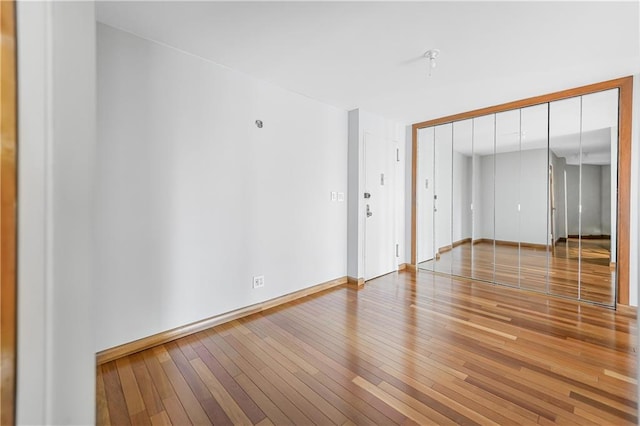 35 Seacoast Ter Unit 8A, Brooklyn, NY 11235 - empty room with hardwood / wood-style flooring and baseboards