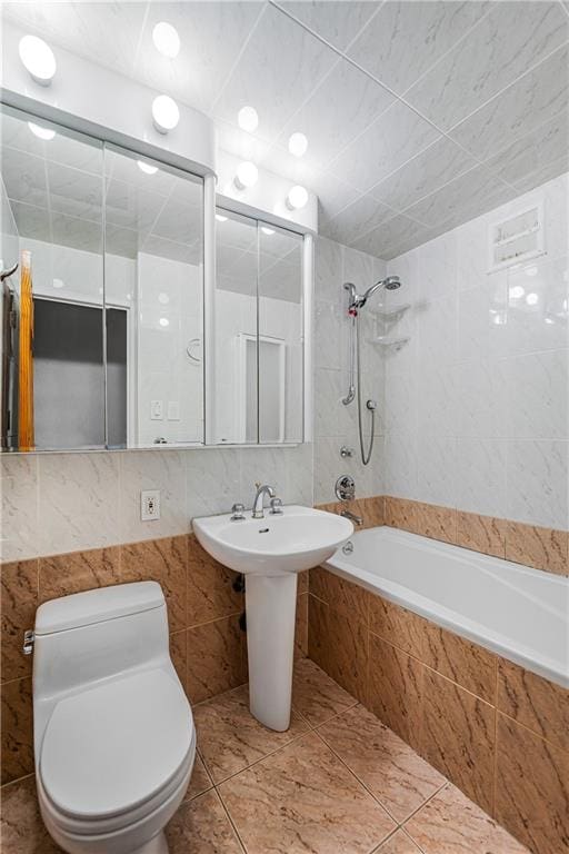 35 Seacoast Ter Unit 8A, Brooklyn, NY 11235 - bathroom featuring tiled shower / bath combo, tile walls, and tile patterned floors