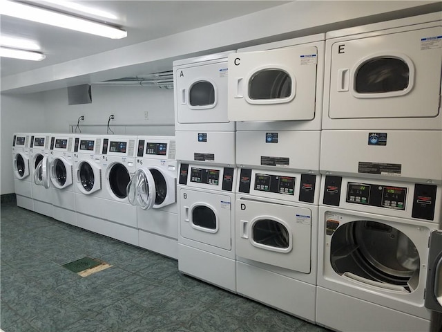 388 Avenue S Unit 2C, Brooklyn, NY 11223 - community laundry room featuring stacked washer / dryer, washing machine and dryer, and dark floors